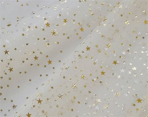 metallic star gold fabric|material with stars on it.